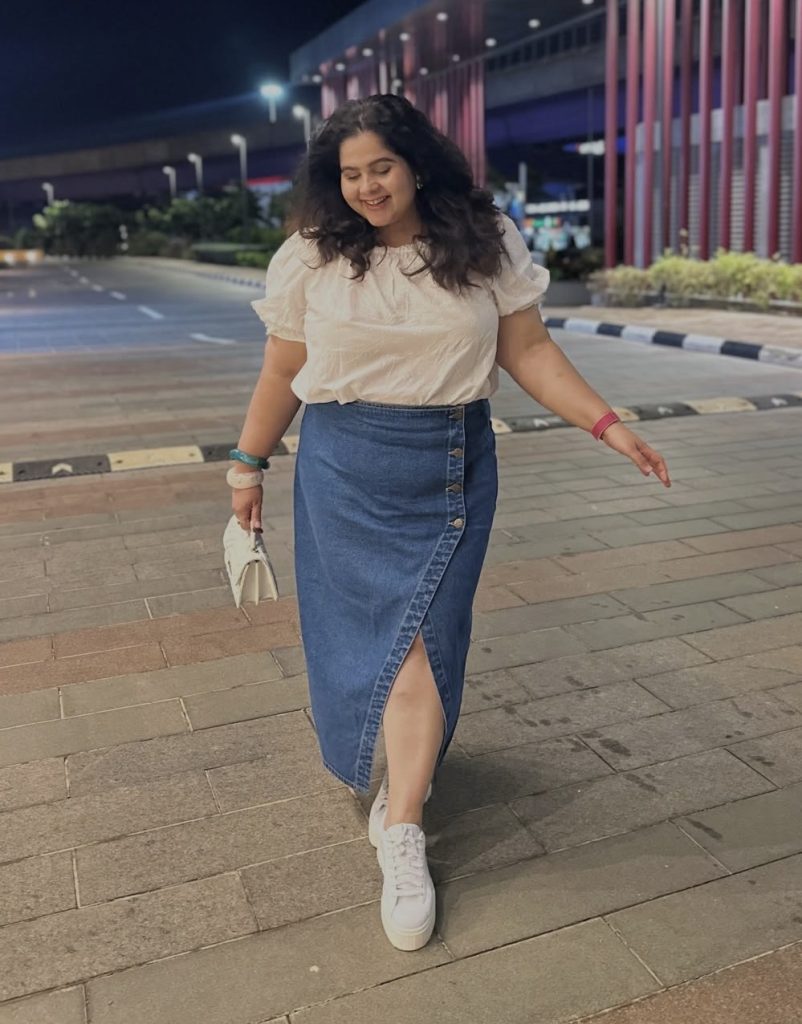 High-Waisted A-Line Skirt With A Tucked-In Blouse