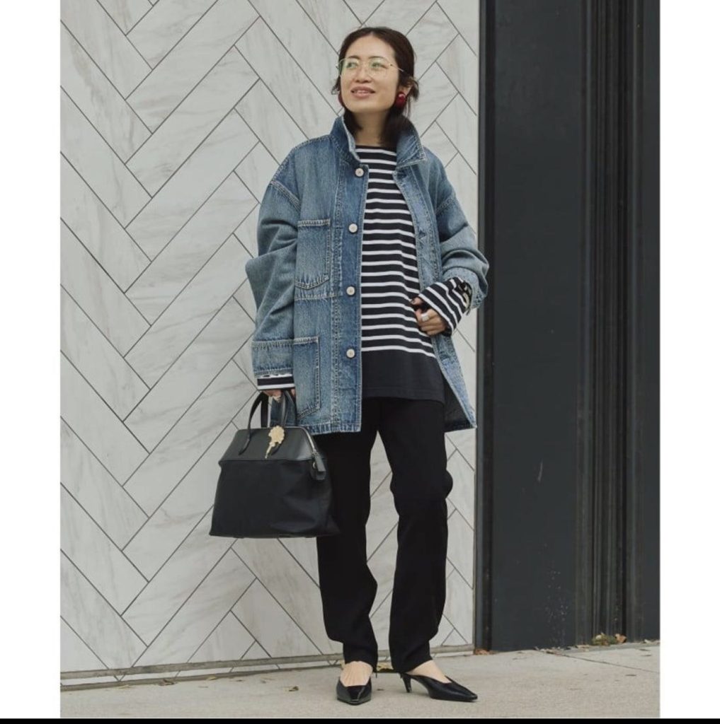 Denim Jacket With Black Pants and a Striped Top